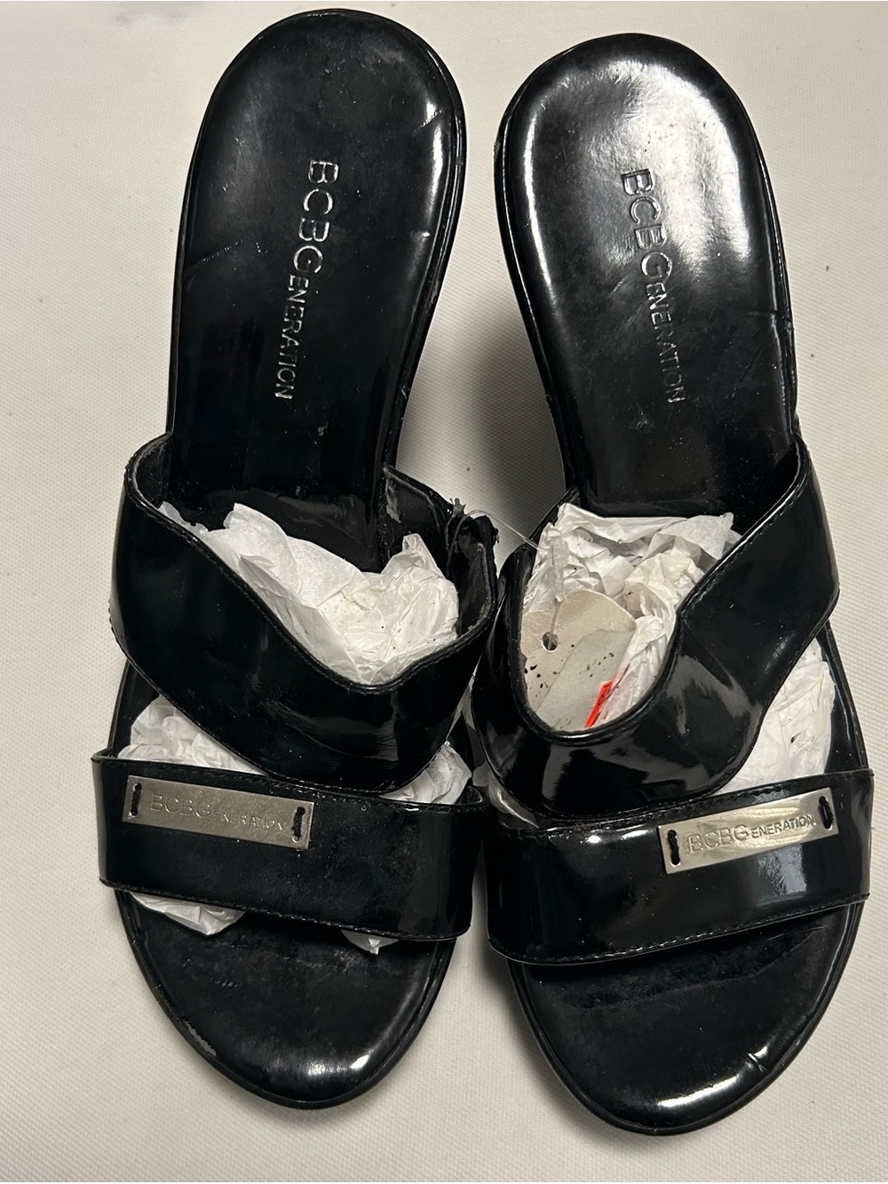 BCBGeneration Black Patent Slide Sandals with Metal Logo Plaque